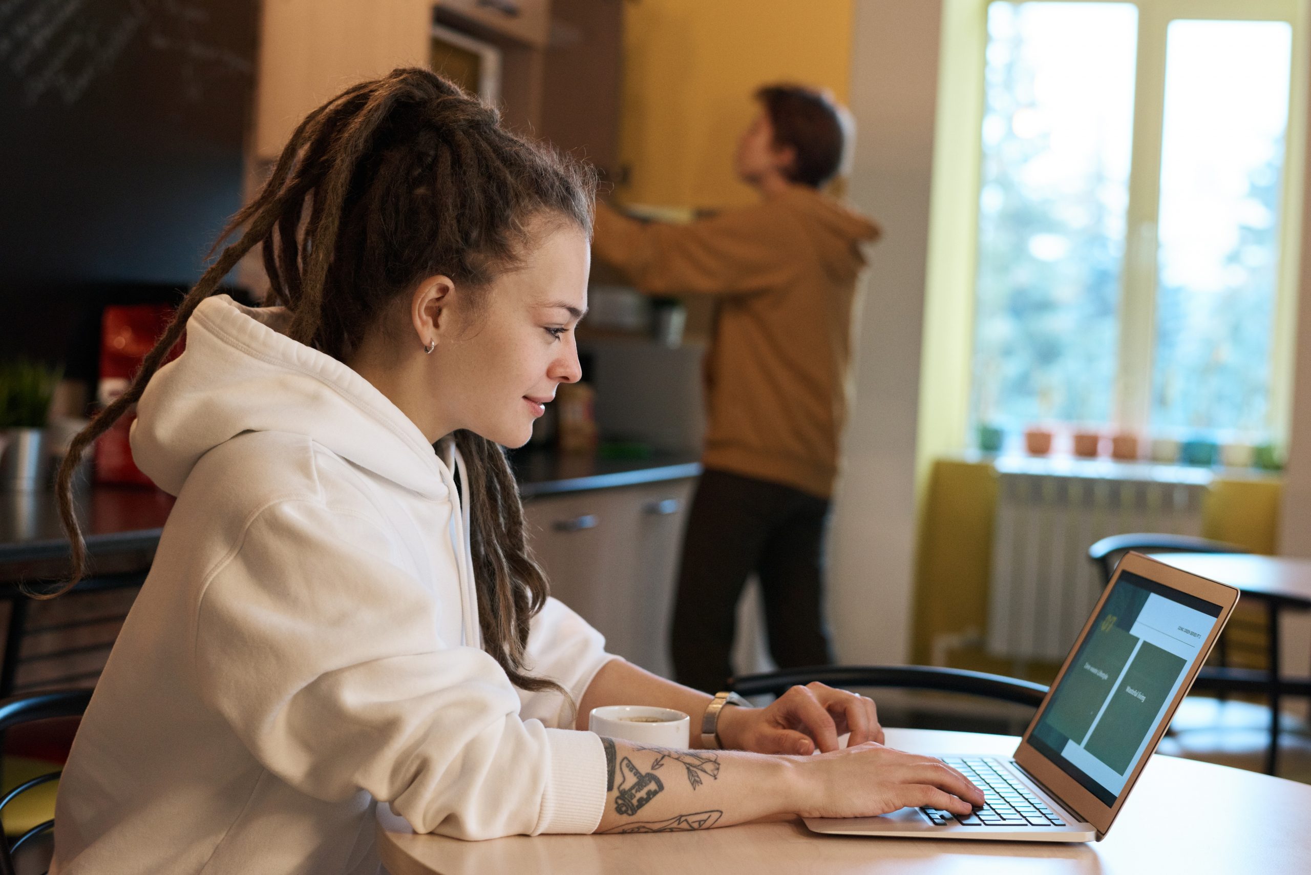 shallow-focus-photo-of-woman-using-a-laptop-3182792